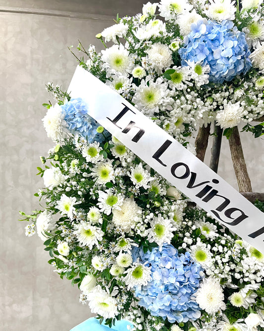 Azure Halo – Blue Hydrangea & White Mum Funeral Wreath