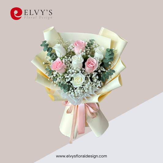 Blush Seven bouquet with three pink roses, four white roses, baby’s breath and eucalyptus